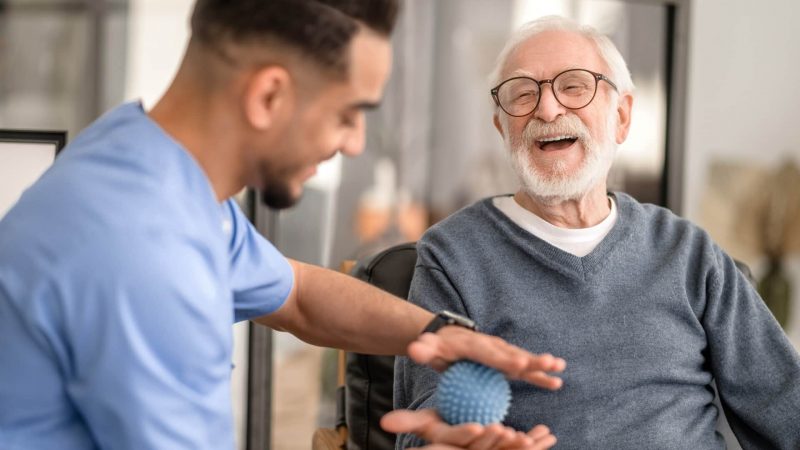 Patient,Having,His,Hand,Massaged,With,A,Spiky,Massage,Ball